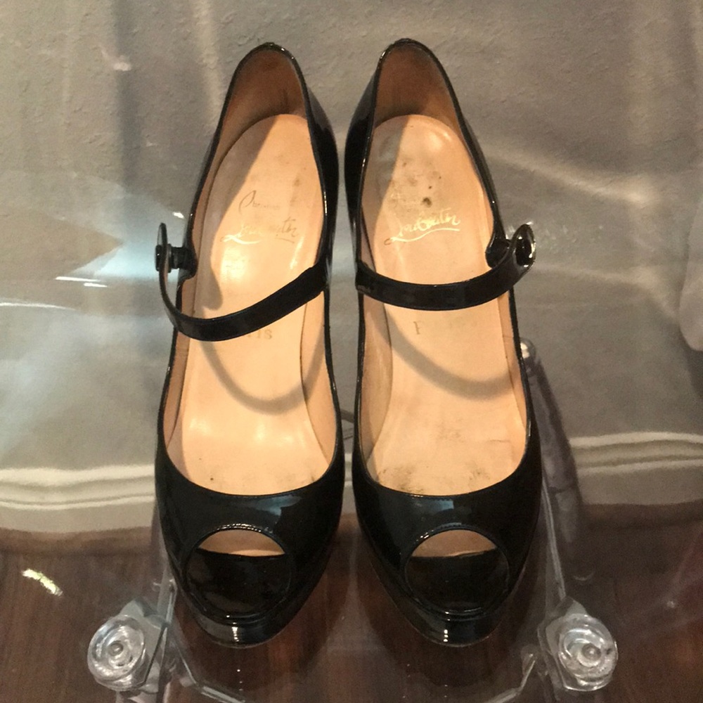Used authentic Christian Louboutin peep toe pumps